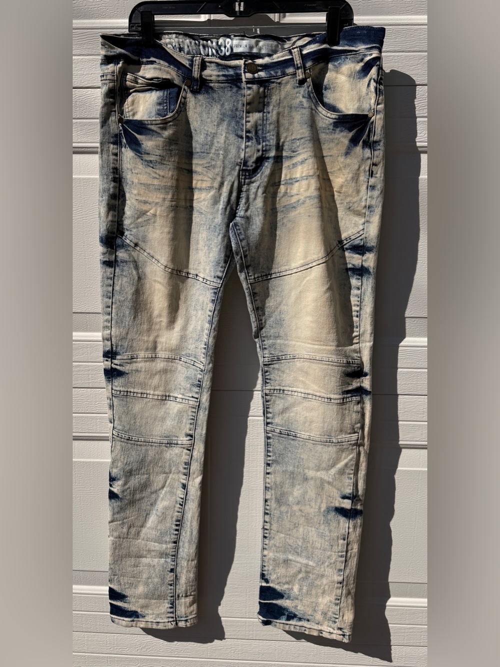 Reason New York blue jeans with distressed, faded, and patched details men’s 38